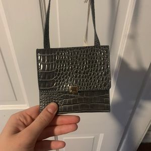 Small card holder with strap.